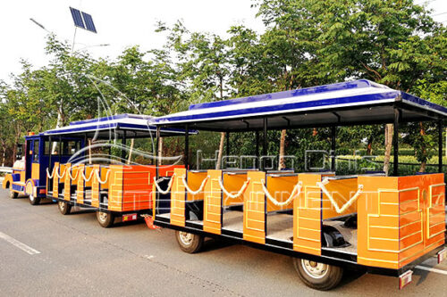 Yellow outdoor trackless open type train ride